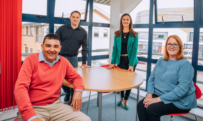 Essential-Print-Service-coworking-space-Derby Yvonne is pictured with her new office buddies who use the Essential Co Working Space