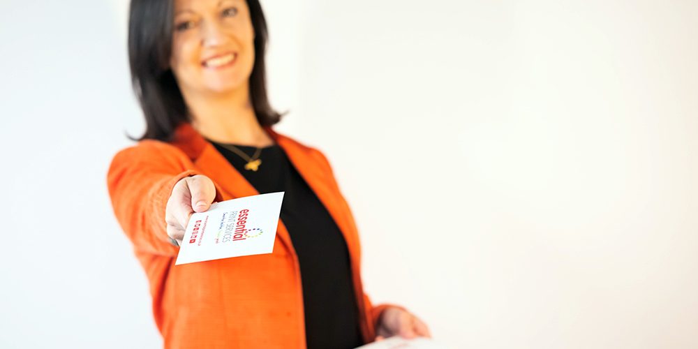 Printed-Flyers-Derby-Essential-Print-Services Yvonne is shown holding out her arm with a printing flyer