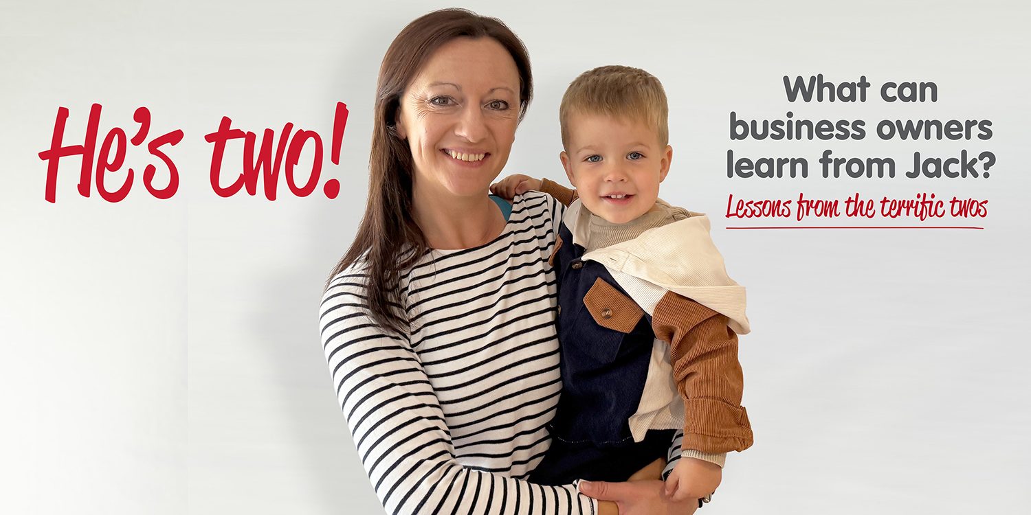Yvonne is holding her son. Yvonne is wearing a stripey blue and white long sleeved top and her son is wearing a brown and blue jacket. The words He's Two! are shown as well as What can business owners learn from Jack. Lesson from the terrific twos.