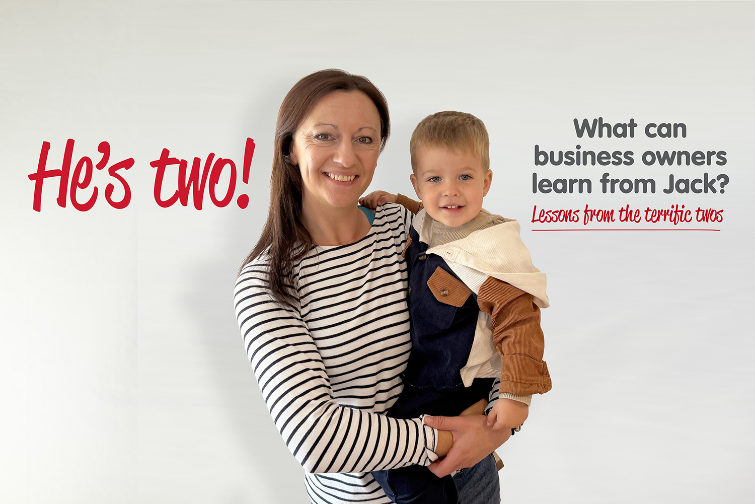 Yvonne is holding her son. Yvonne is wearing a stripey blue and white long sleeved top and her son is wearing a brown and blue jacket. The words He's Two! are shown as well as What can business owners learn from Jack. Lesson from the terrific twos.